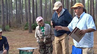 Marsha and John Hooten with Tim Crews announcing events of the day