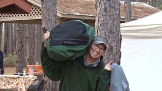 Bruce Varner taking out camping gear since it is the last work day