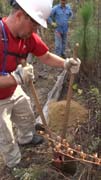 Nick takes a turn with the post hole digger