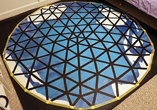 After four hours, remove protective tape to reveal the black framework of the dome structure, leaving the outer circle
