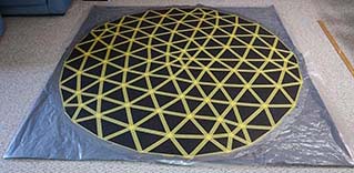 Mask the corners of the mat with plastic sheeting secured with duct tape