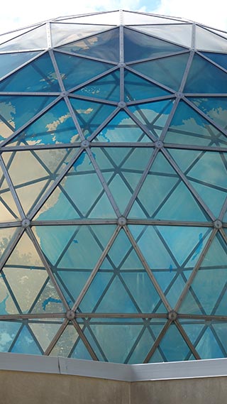 Outside the front entrance to Fuller Dome on the 90th meridian